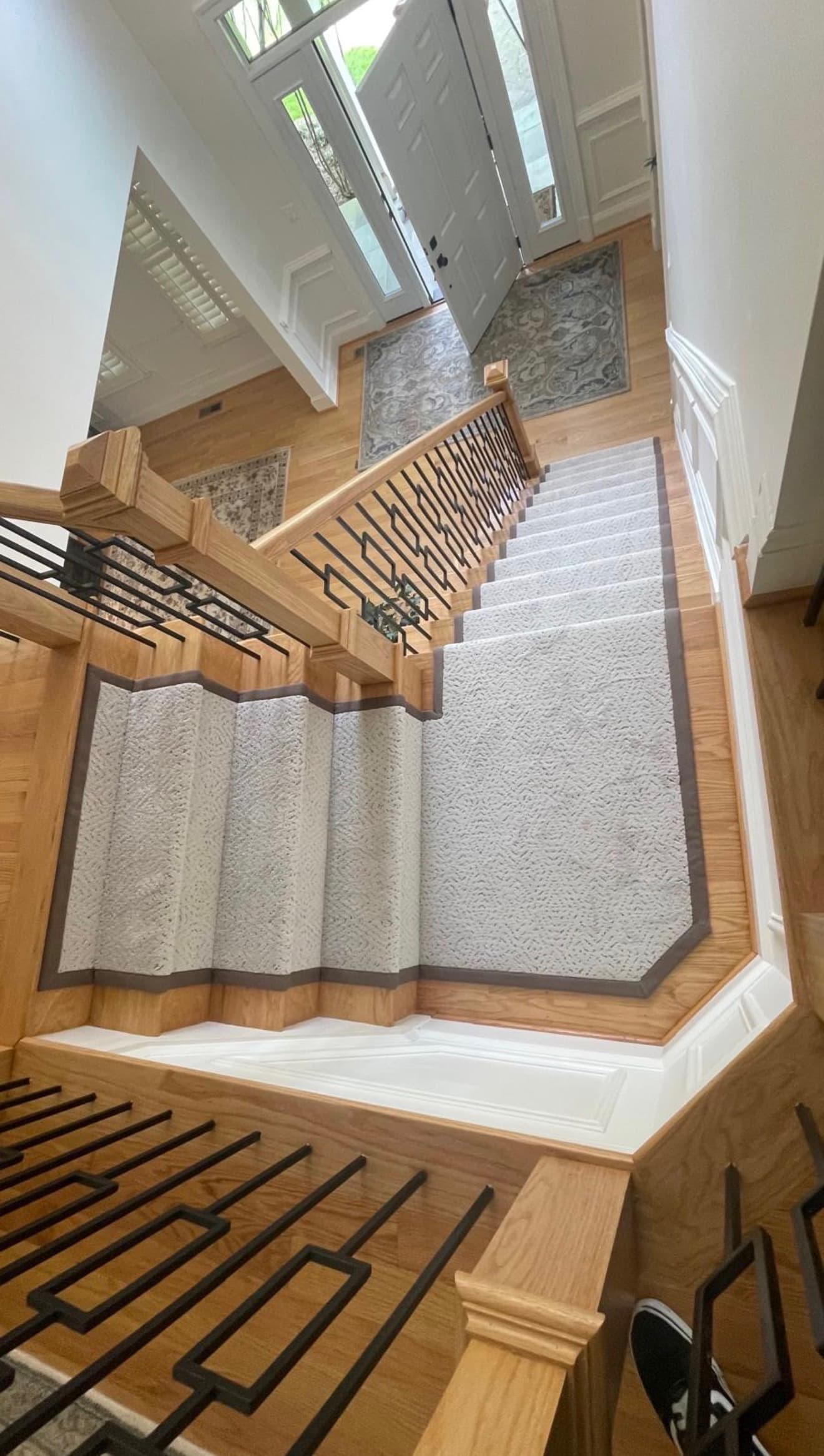 Custom cream carpet runner with brown binding covering staircase landing in Northern Virginia